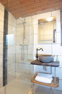 a bathroom with a sink and a shower at Britannia Petite Lodge - Still Rabbit - Hot Tub - Yorkshire in Selby