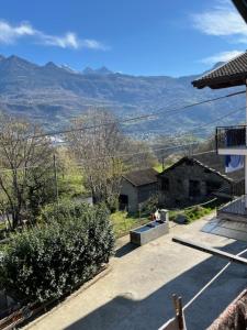 a view of a house with mountains in the background at Pres du Chateau in Châtillon