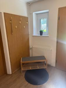 a room with a table and a door and a window at Ute Urbaner in Irschen