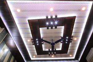 a clock on the ceiling of a building at Swastik homestay ayodhya in Ayodhya