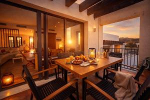 a dining room with a table on a balcony at Starfish Mojácar in Mojácar