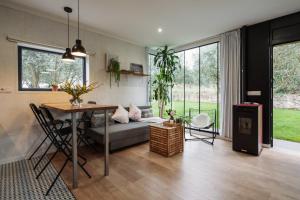 a living room with a couch and a table at Casa Salitre in Boiro