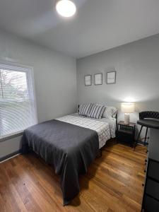 a bedroom with a bed and a window at Midtown Detroit Upper Retreat in Detroit