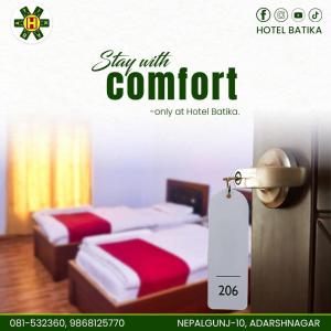 a poster for a hotel room with two beds at Vatika Hotel Pvt Ltd in Nepālganj