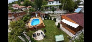 an overhead view of a house with a swimming pool at Guest House „ Mountain Rest“ in Lilyanovo