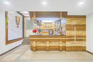 a restaurant with a counter in the middle of a room at MGR Residency in Pondicherry