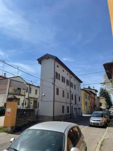 a car parked in front of a white building at Piccola dimora Casalecchio vicino al GranReno e Unipol in Zola Predosa