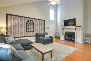 a living room with a couch and a fireplace at Pinehurst Condo ~ 2 Miles to Downtown & Resort! in Pinehurst