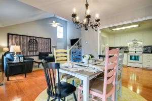 a kitchen and living room with a table and chairs at Pinehurst Condo ~ 2 Miles to Downtown & Resort! in Pinehurst