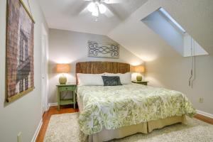 a bedroom with a bed and two night stands at Pinehurst Condo ~ 2 Miles to Downtown & Resort! in Pinehurst