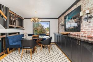 a dining room with a table and chairs at The Disco Chalet in Steamboat Springs