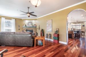 a living room with a couch and a table at Pool Table, Massive Balcony, Firepit, & Spacious! in Sherrills Ford +44 photos