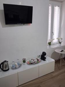 a white cabinet with a television on top of it at NaMi in Battipaglia