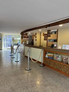 a lobby of a store with a counter and a counter at Gran Lençóis in Barreirinhas +47 photos