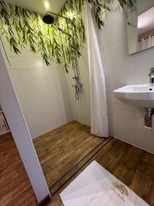 a bathroom with a shower and a sink at Mirabelka Mucharz in Mucharz +39 photos