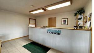 an empty room with a counter in a restaurant at North Winds Lodge LLC in Bowman