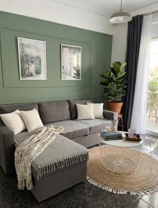 a living room with a couch and a table at Dimi Guest House in Perea