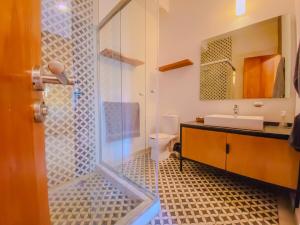 a bathroom with a shower with a sink and a toilet at Spacious modern and centrally located in Puebla +105 photos