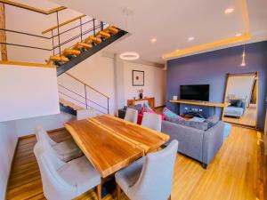 a living room with a table and a couch at Spacious modern and centrally located in Puebla