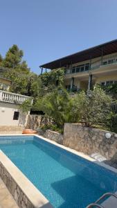 a swimming pool in front of a building at GreenHouse in Brca