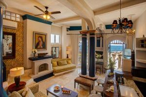 a living room with a couch and a fireplace at Quinta Maria Cortez Beach Hotel in Puerto Vallarta