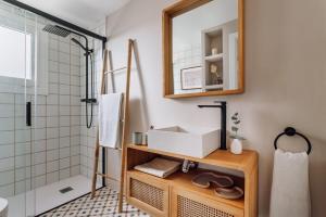 a bathroom with a sink and a shower at Impressive beachfront home in Calafell +22 photos