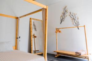 a bedroom with a bed and a mirror at Lilium Rooms in Çeşme +52 photos