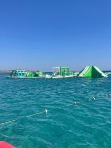 a group of boats in a body of water at Lilium Rooms in Çeşme