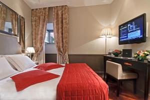 Postel nebo postele na pokoji v ubytování Hotel Lunetta