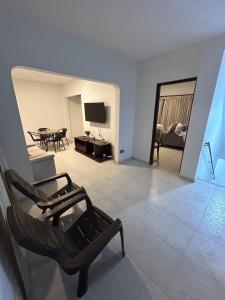 a living room with a couch and a table at Apartamento 201 amplio cómodo in Cali