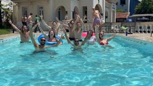 a group of people in a swimming pool at Casa das Luzes Hostel IVN in Rio de Janeiro