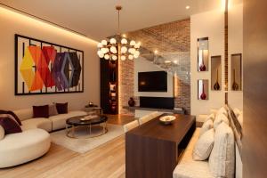 a living room with a couch and a table at Maison Bauchart in Paris