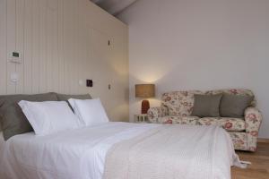Cama ou camas em um quarto em Lugares Com História