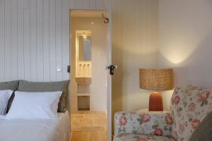 Cama ou camas em um quarto em Lugares Com História