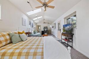 a bedroom with a bed and a living room at Cresta Loft in Twain Harte