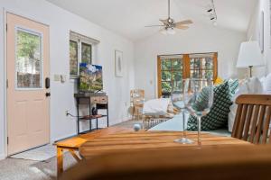 a living room with a wine glass on a table at Cresta Loft in Twain Harte