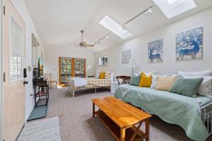 a living room with a couch and a table at Cresta Loft in Twain Harte