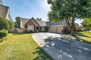 a house with a tree and a driveway at The Tulsacation on Oxford in Tulsa