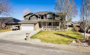 a house on a street with a driveway at Fossil Crest Retreat in Vernal