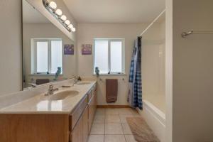 a bathroom with a sink and a shower at Hidden Views Cabin in Twain Harte +40 photos