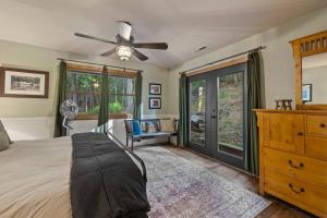a bedroom with a bed and a ceiling fan at Hot Tub - Huge Deck - Lake Access in Twain Harte