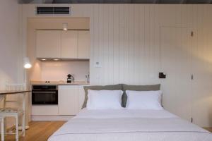 Cama ou camas em um quarto em Lugares Com História