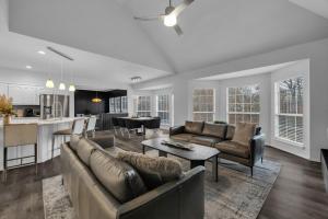 a living room with a couch and a table at The Tulsacation 2 in Tulsa