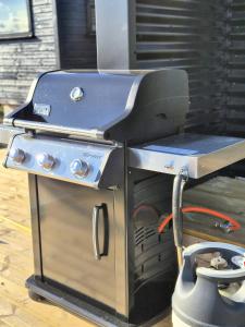 a grill sitting on top of a table at Northern Lights Cabin - Syribr in Grímsnes og Grafningshreppur