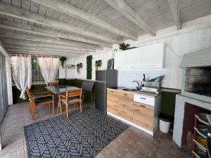 a kitchen with a table and a dining room at House Varna-2 in Krapets +13 photos