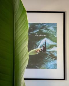 a picture of a person on a surfboard in the water at The Salty Nap in Ericeira +17 photos