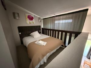 a bedroom with a bed with a towel on it at Le Moulin de Sournia in Sournia +59 photos