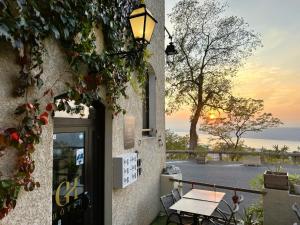 a door to a building with a view of the ocean at GABRIELLE HOTEL in Aiguines
