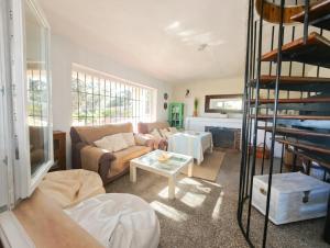 a living room with a couch and a table at Casa Terra in Hontanar +27 photos