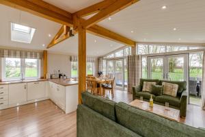 a living room with a couch and a table at Primrose 2 bed-No Pets-Daisy in Eye